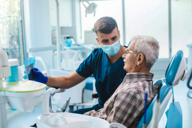 Dentist with a elderly patient